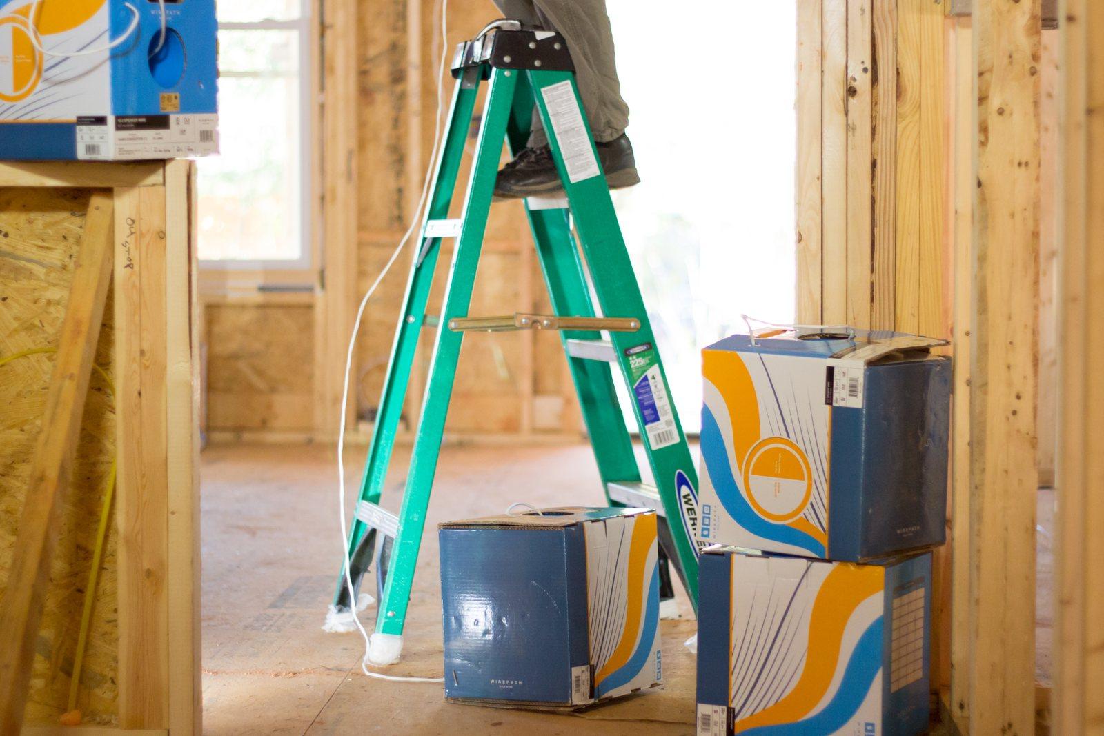 Ladder and boxes of Wirepath wire in a home at the framing stage